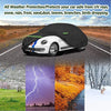 A black all-weather car cover protects a white VW New Beetle from various weather conditions.