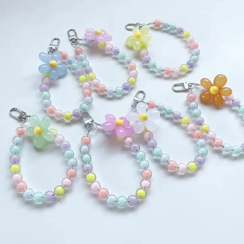 A collection of colorful phone anti-loss lanyards featuring round bead pendants in shades of pink, yellow, and blue.
