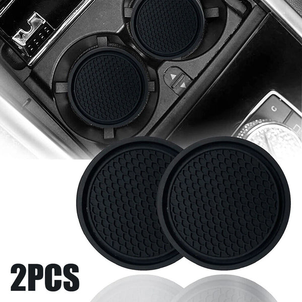 Two black silicone car cup holder inserts shown in a close-up view.