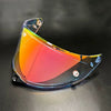 Clear polycarbonate motorcycle helmet visor with a vibrant rainbow gradient finish
