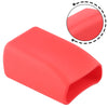 A bright red silicone seat belt buckle cover shown from above with a magnified view of the design.