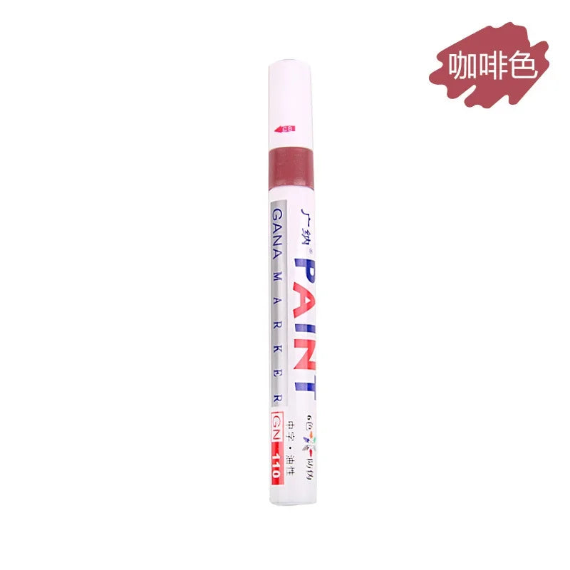 Tube de peinture GANA MARKER avec un bouchon rose et un corps blanc pour la création et la décoration.