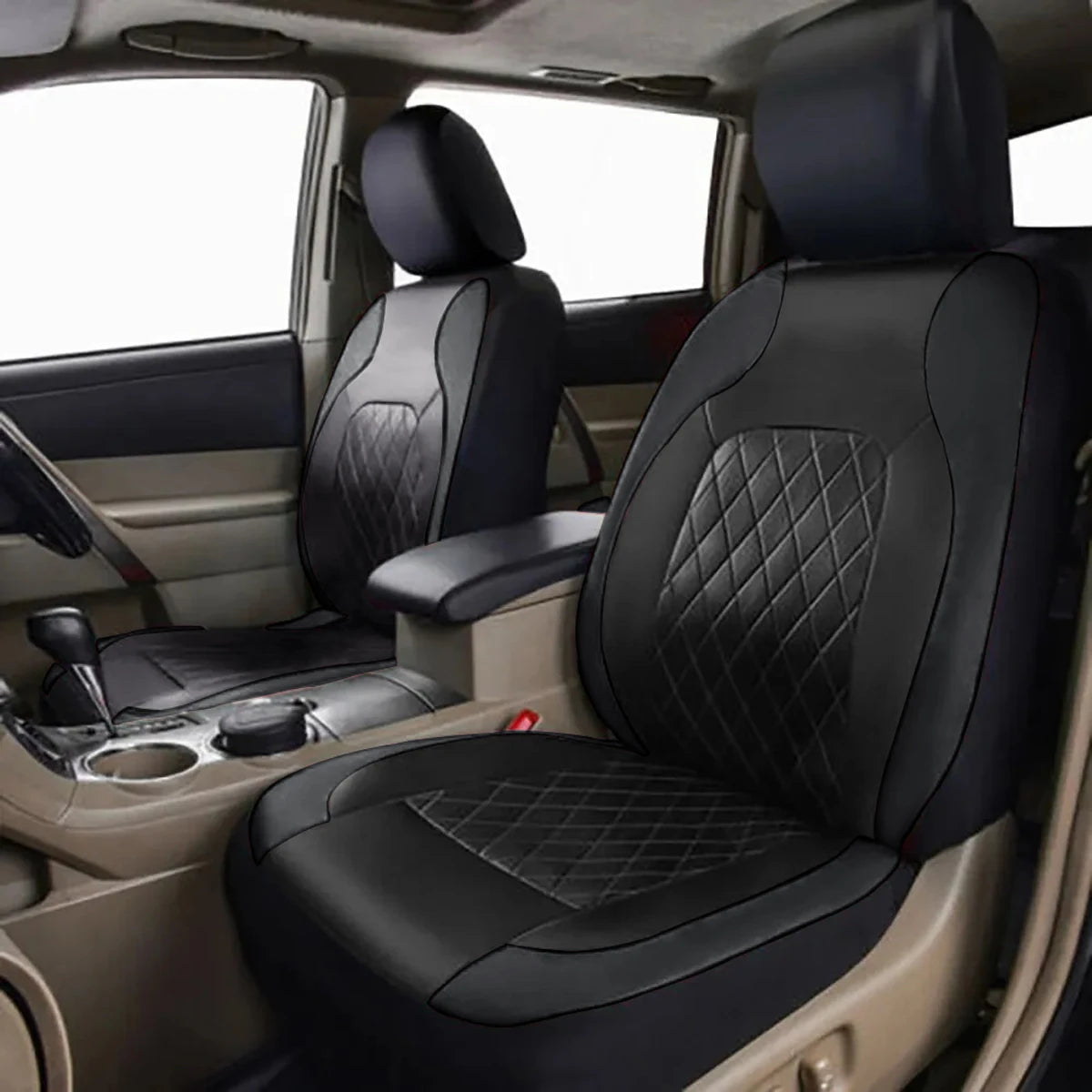 Interior view of a car seat with black leather covers and beige upholstery.