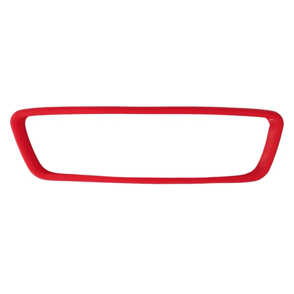 Red silicone edge protector for a vehicle's rearview mirror.