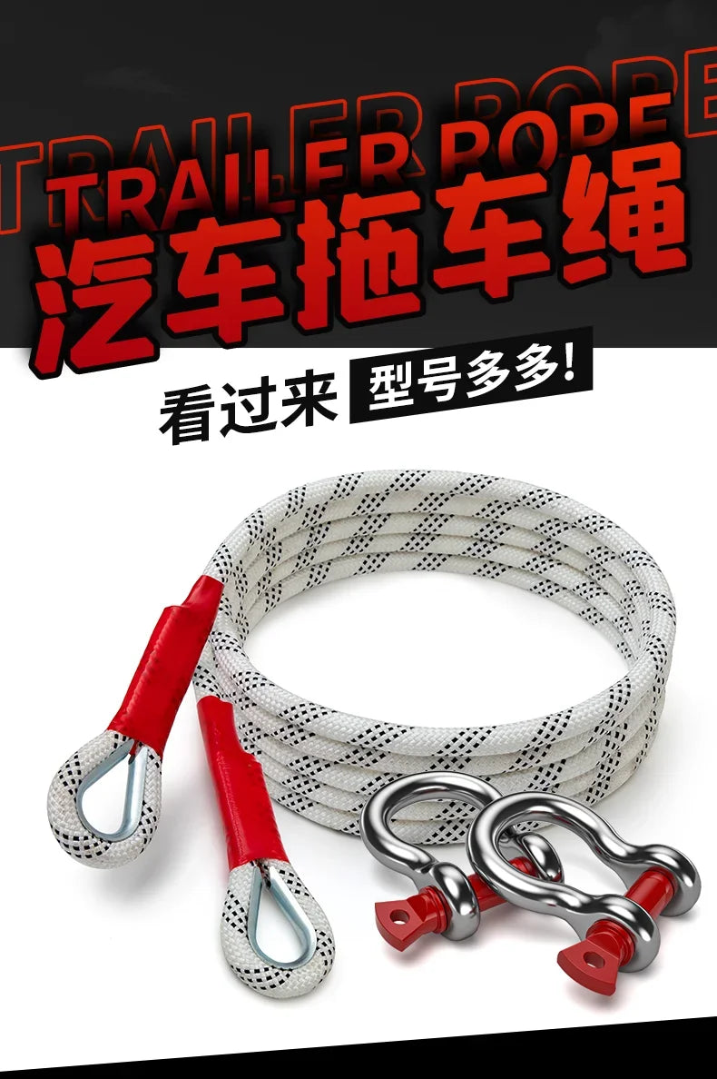 A coil of heavy duty vehicle towing rope with red and silver clasps is shown against a black background.