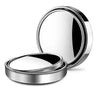 A round, chrome rearview mirror with a reflective surface shown from above and the side.