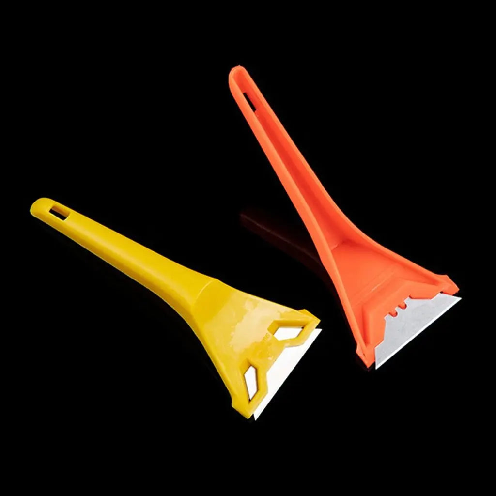 An orange and yellow versatile razor scraper tool used for cleaning glass, tile, and various surfaces.