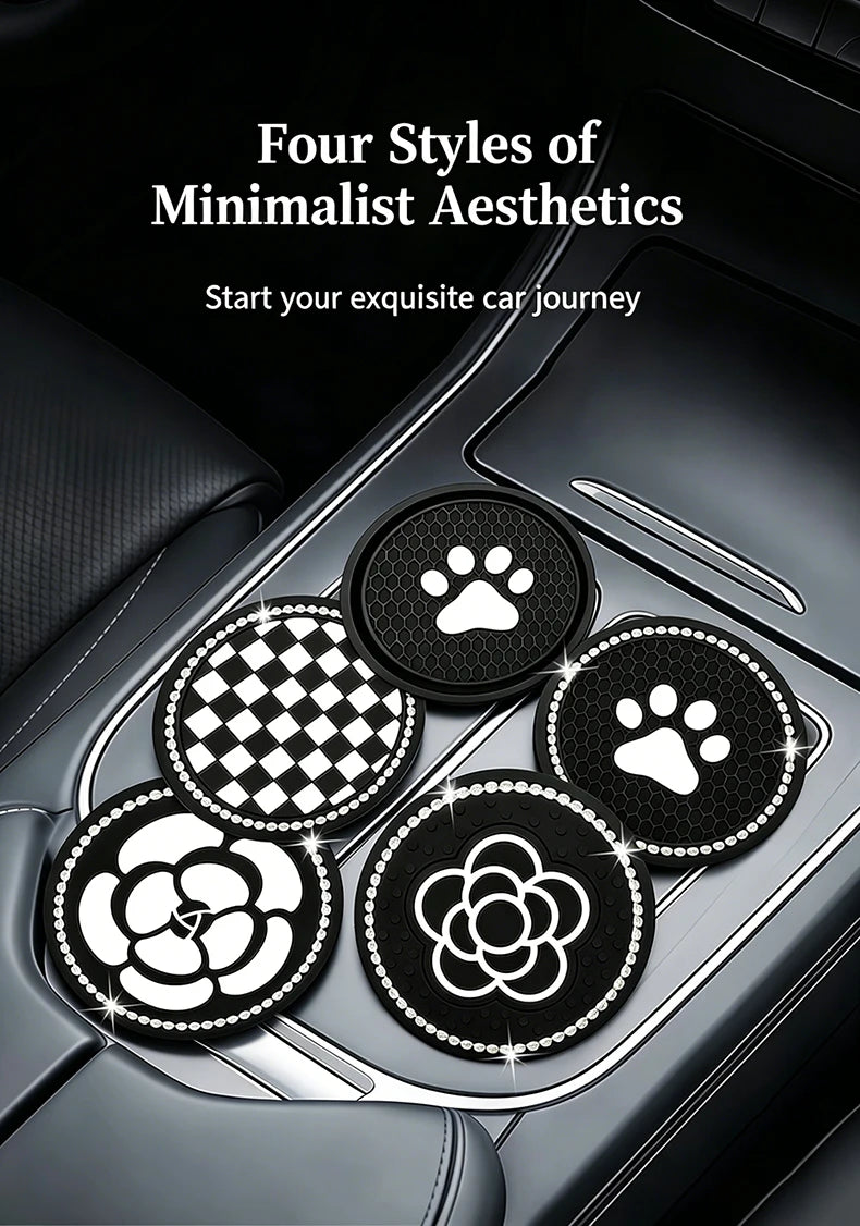 Four circular coasters featuring paw prints and floral designs placed in a car cup holder.