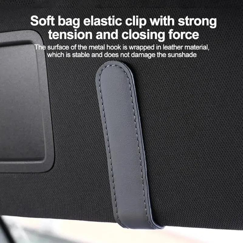 Nahaufnahme einer weichen Tasche mit elastischem Clip und Metallhaken und Lederumwickelung zur Befestigung eines Sonnendachs 