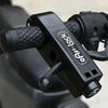 A black universal motorcycle handlebar security lock is shown in a close-up view.