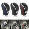 Three views of a black manual gear shift knob with blue and red speed covers shown in a car interior context.