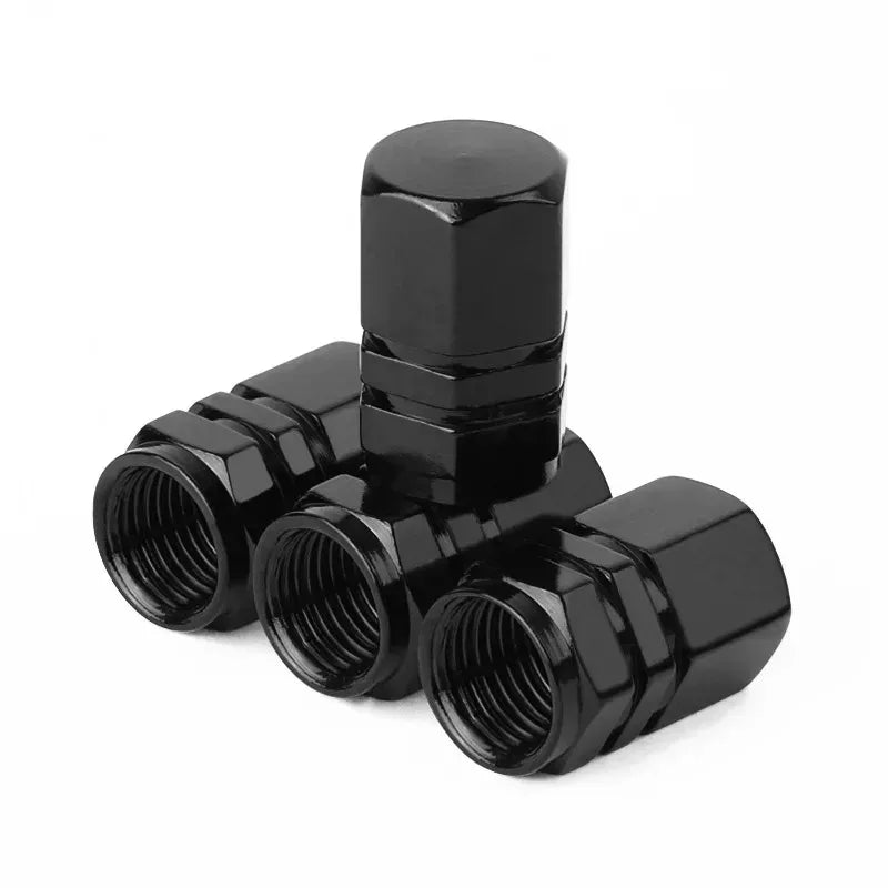 A set of black durable aluminum valve caps for wheels and tires.
