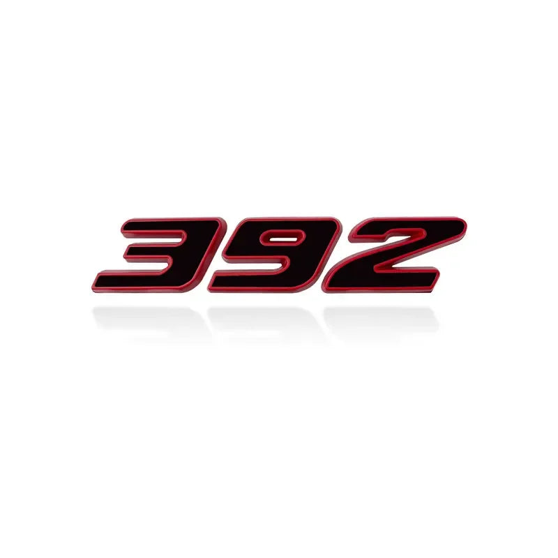 A close-up view of a 3D metal car fender side and trunk decal with the number 392 in red and black lettering.