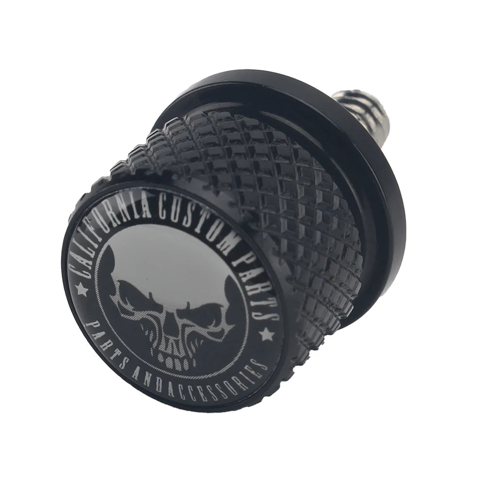 Black aftermarket motorcycle seat and fender bolts with a textured finish.