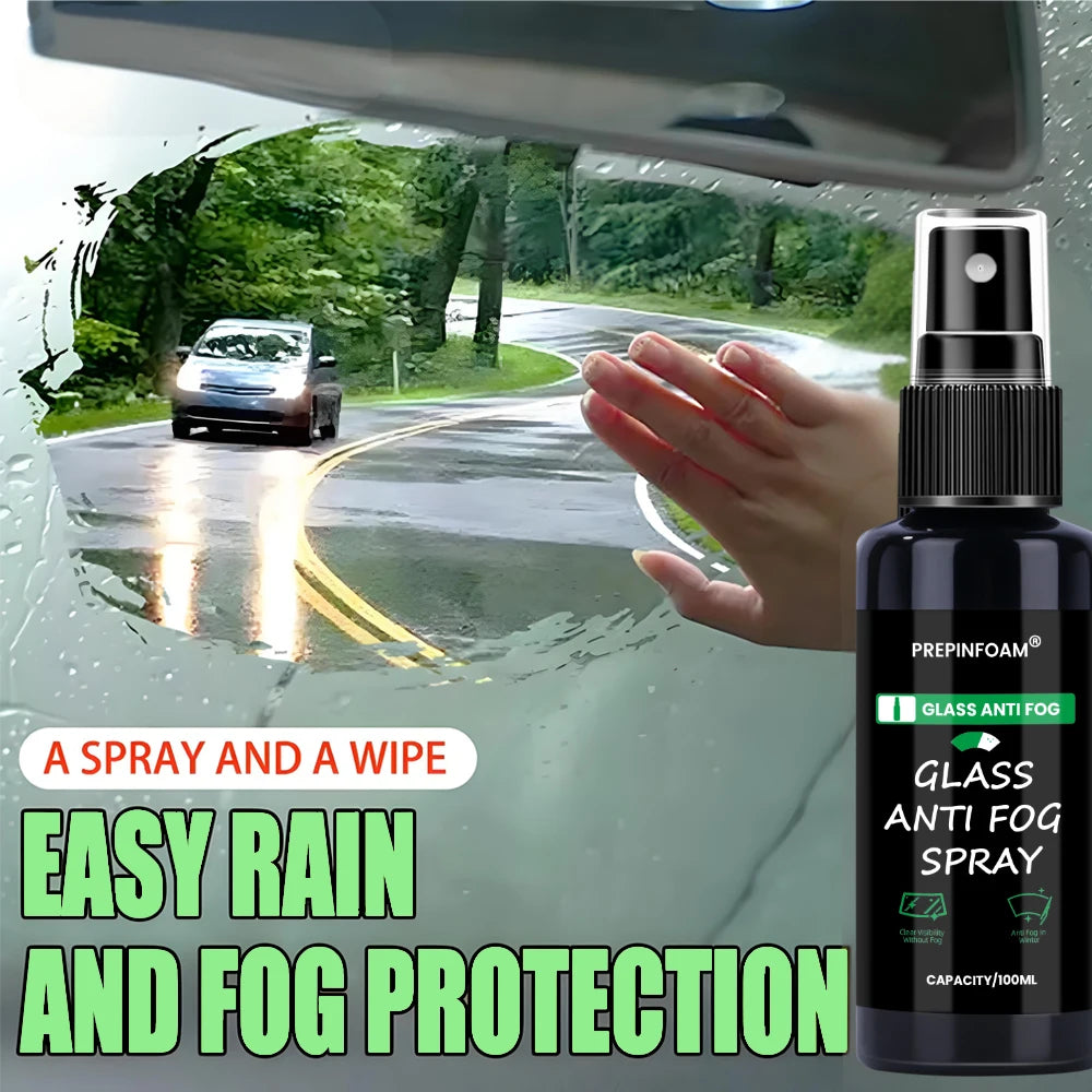 A hand is spraying a glass anti fog spray onto a car windshield during the rain.