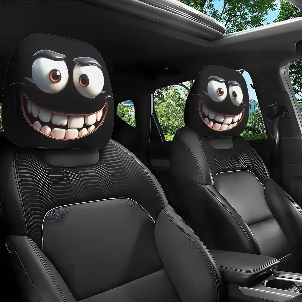 Black car seat headrest covers with decorative smiley face designs installed in a vehicle interior.