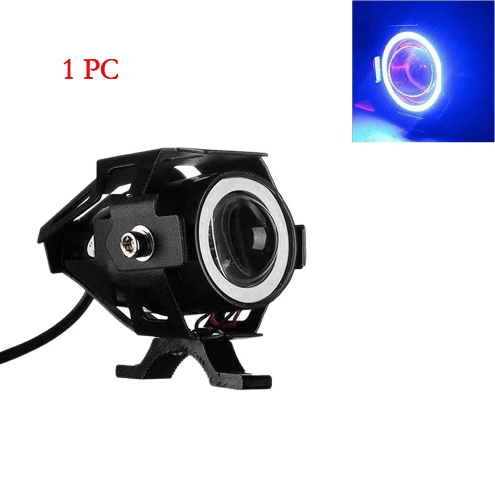 A black universal LED motorcycle headlight spotlight with a lens and cable.