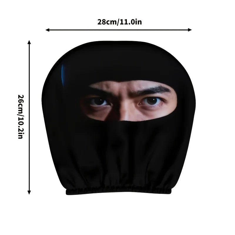 Black mysterious eye print car seat headrest covers shown flat with dimensions 28cm by 26cm.