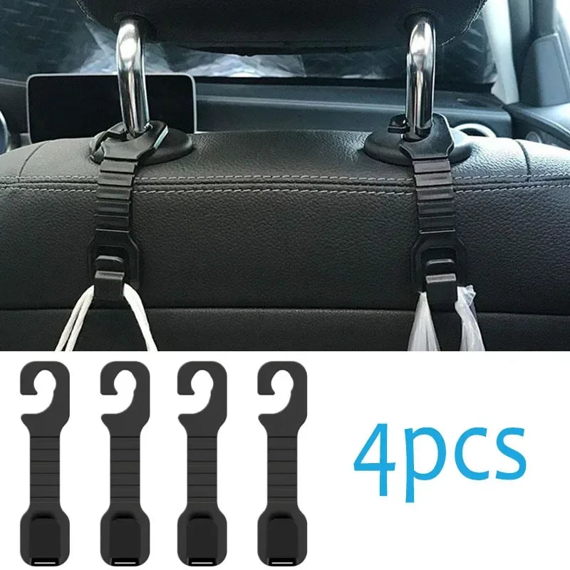Four black universal car seat back headrest storage hooks for securing items.