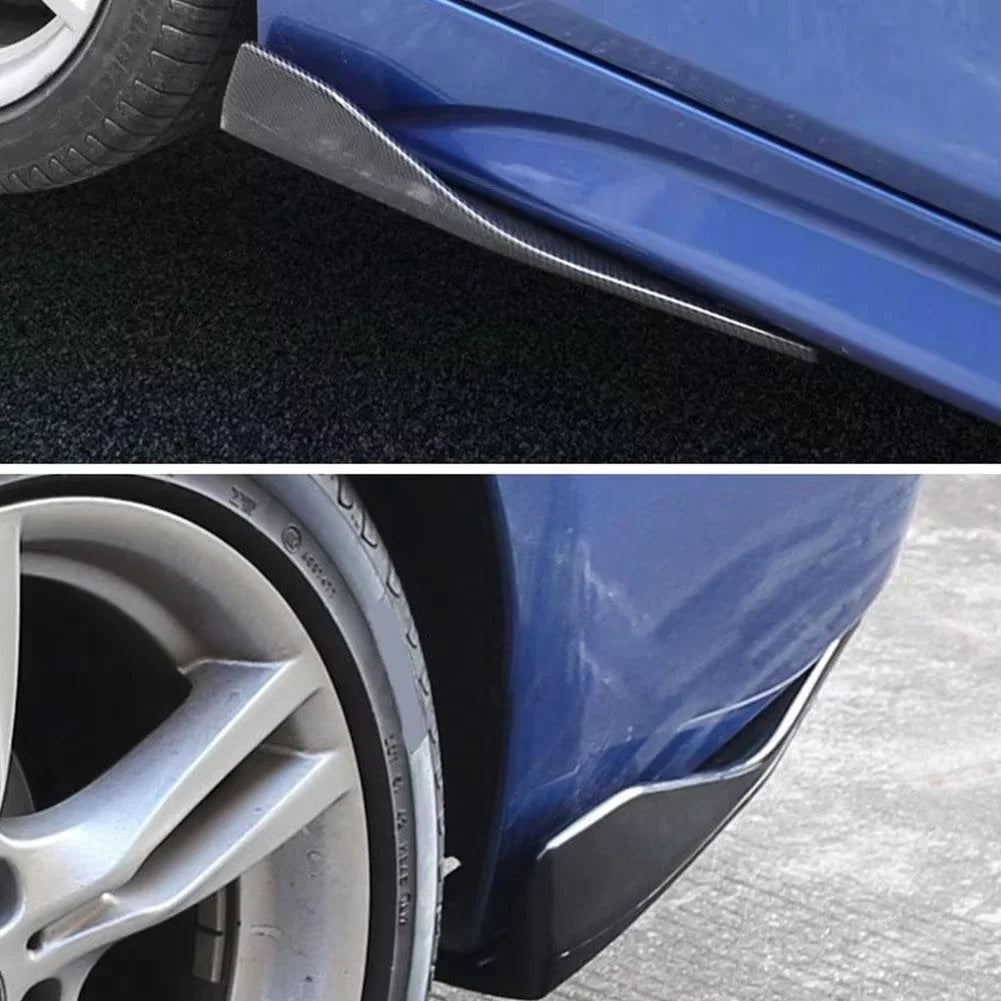 Close-up view of a blue car bumper with an installed black diffuser lip and a silver wheel.