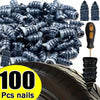 A pile of 100 black rubber tire repair nails next to a tire tread.