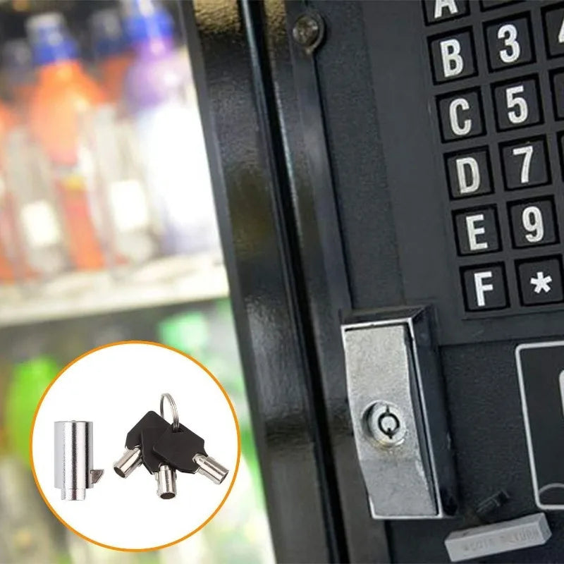 A close-up view of a black vending machine lock set featuring a key and a security latch mechanism.