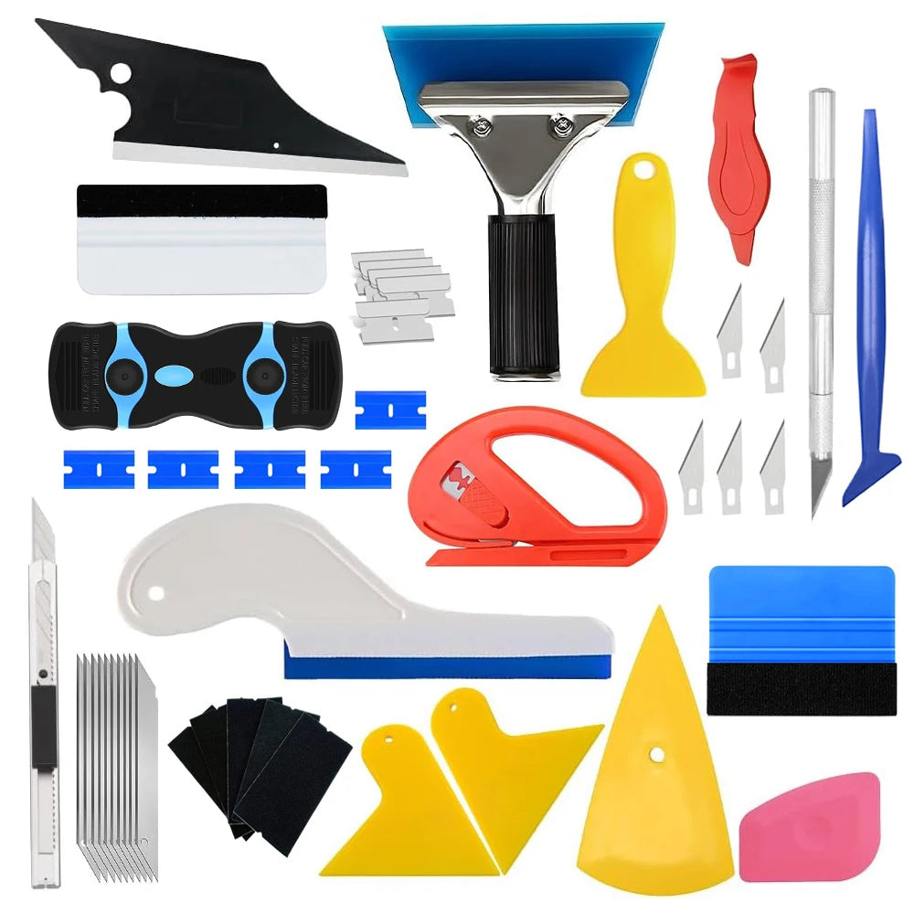 A collection of professional car window tinting tools including blades, cutters, and specialized shaping tools.