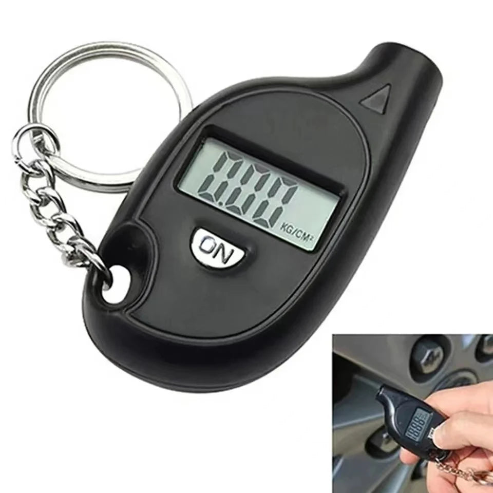 A black digital tire pressure gauge with a metal clip is shown next to a hand holding a car tire.