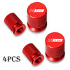 Set of four red N Line aluminum tire valve caps with textured surfaces