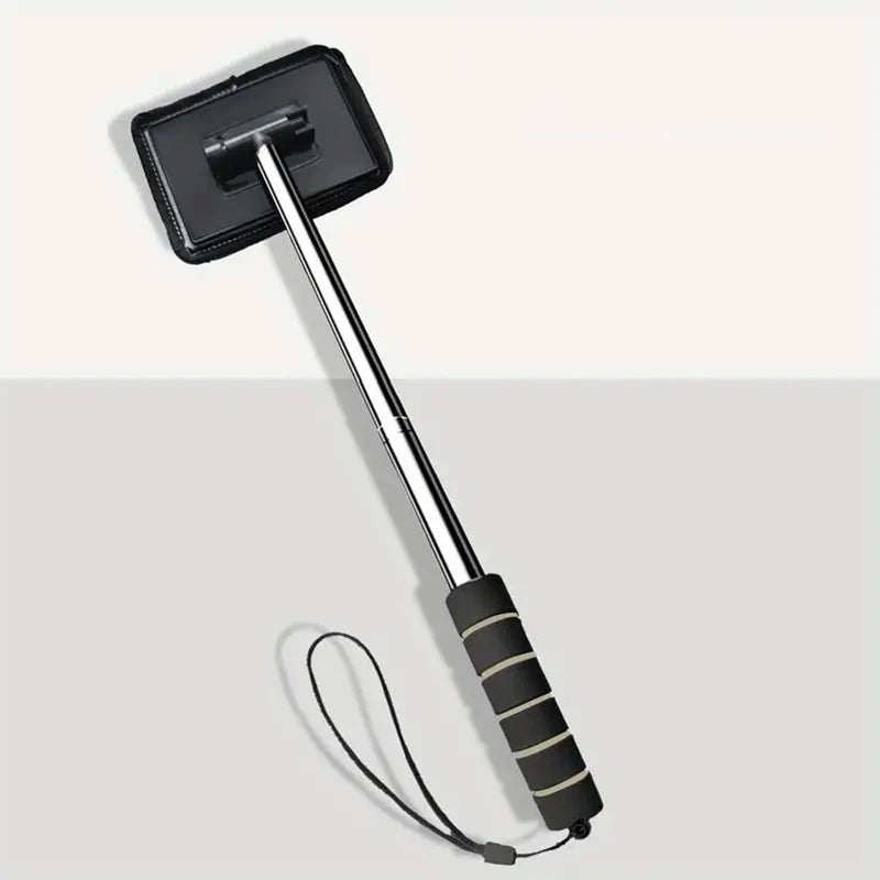 A silver telescopic windshield cleaning brush with a black head and cord is shown against a light gray background.