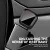 A black car seat belt extender with a quick-release buckle is shown against a dark car interior background.
