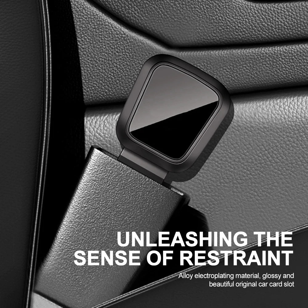 A black car seat belt extender with a quick-release buckle is shown against a dark car interior background.