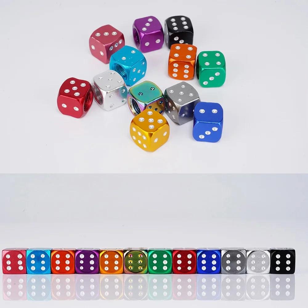 A collection of colorful aluminum dice valve caps arranged in a scattered pattern.