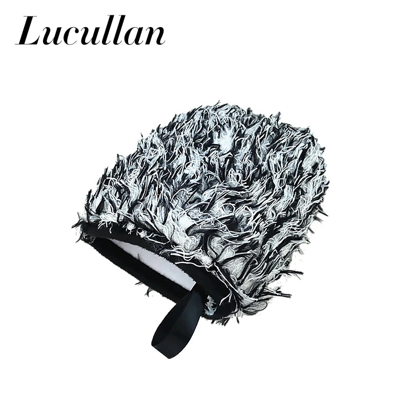 A black detailing wash mitt with a white, fluffy microfiber head is shown.