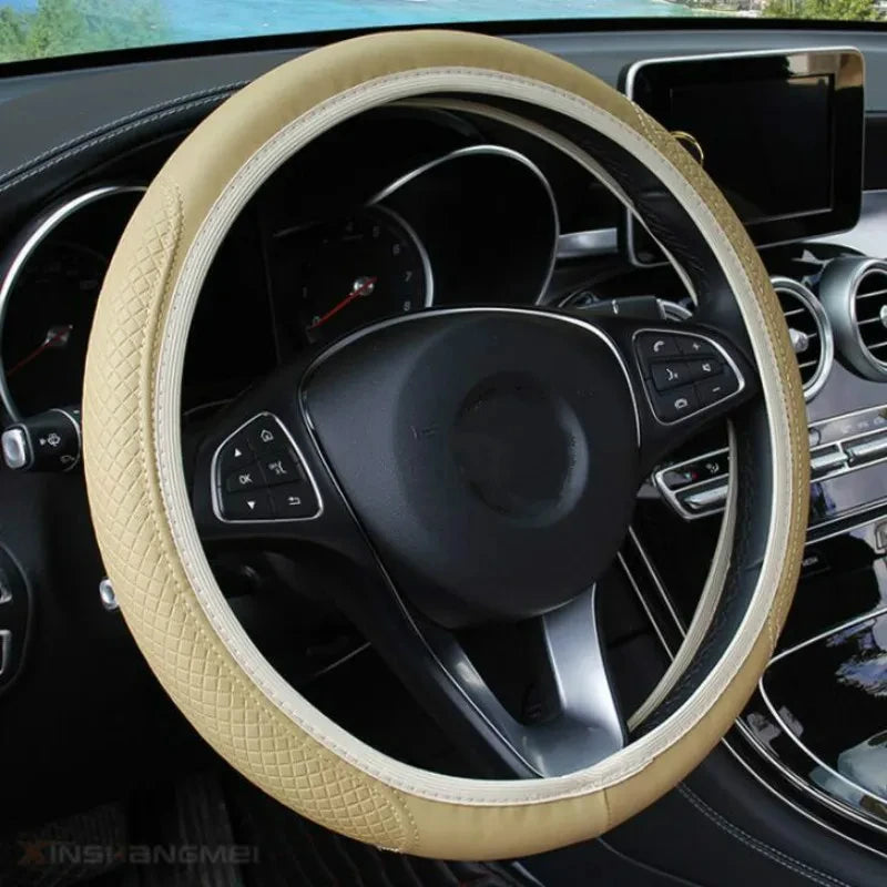 A beige anti-slip leather steering wheel cover is shown inside a car's interior.