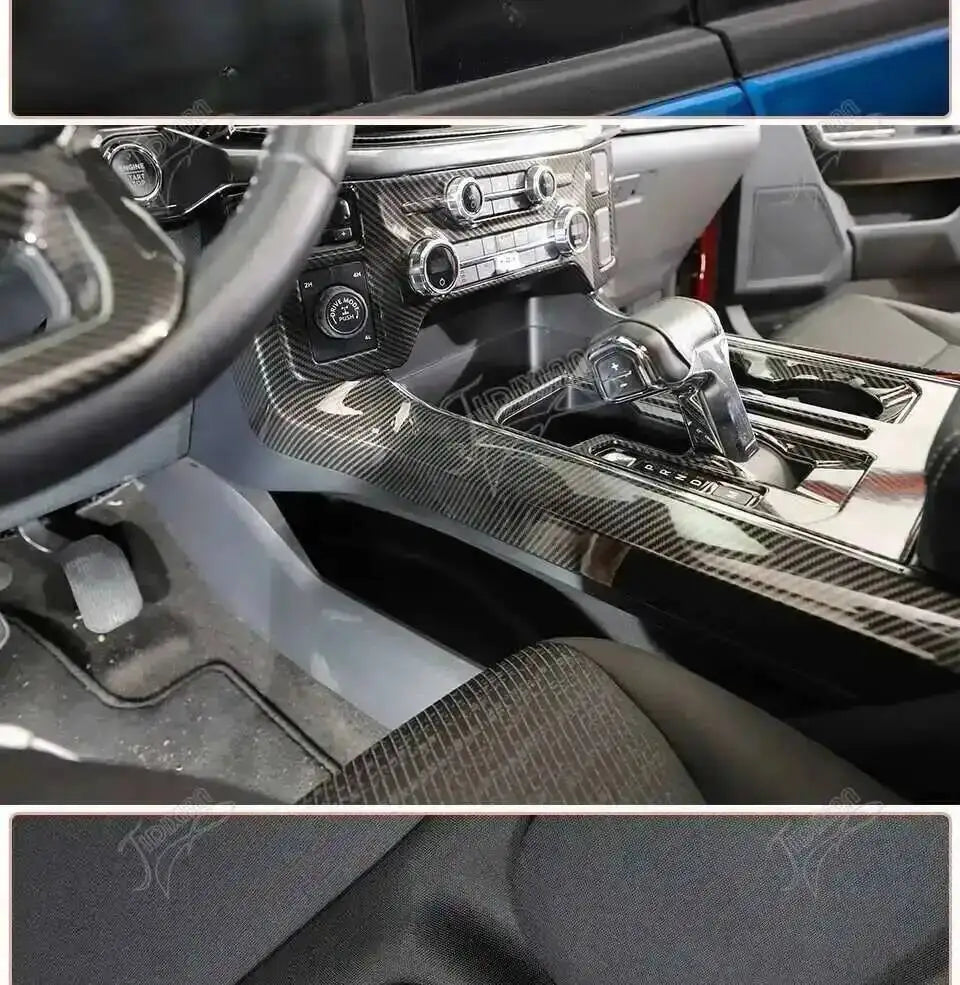 Close-up view of carbon fiber grain interior trim kit installed on a Ford F-150 dashboard and steering wheel.