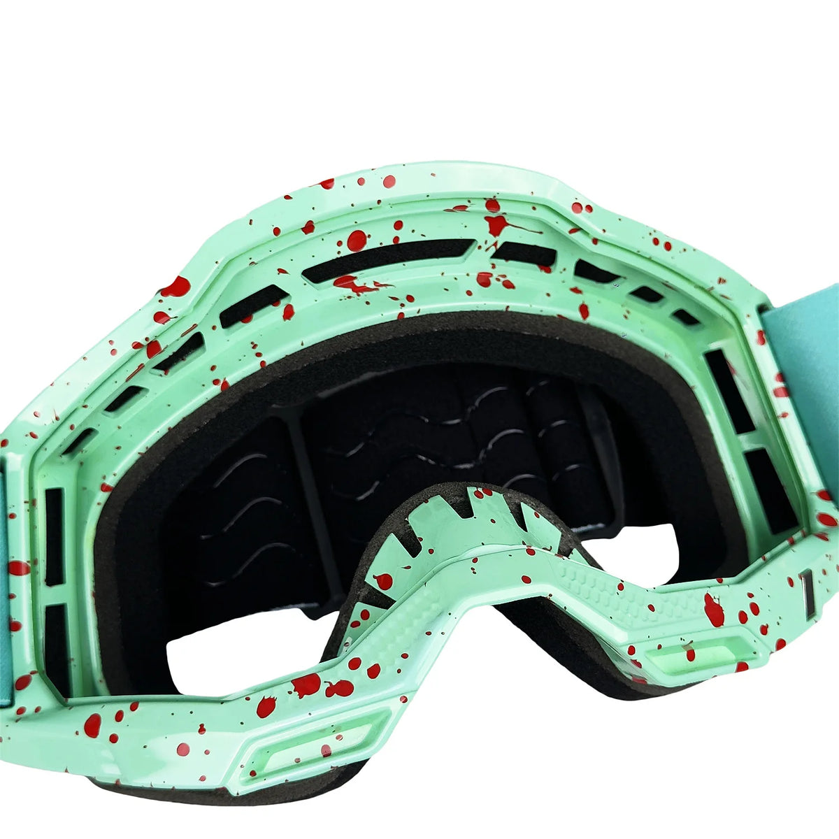 Ein Paar vielseitige Fahrrad- und Skygoggles mit hellem grünem Rahmen und rotem Splatterdesign.