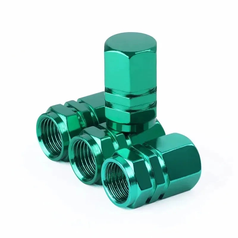 A green aluminum valve cap with a hexagonal fitting is shown against a white background.