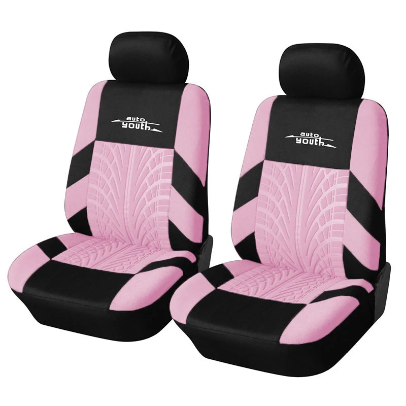 A pair of pink and black auto youth car seat covers and supports.