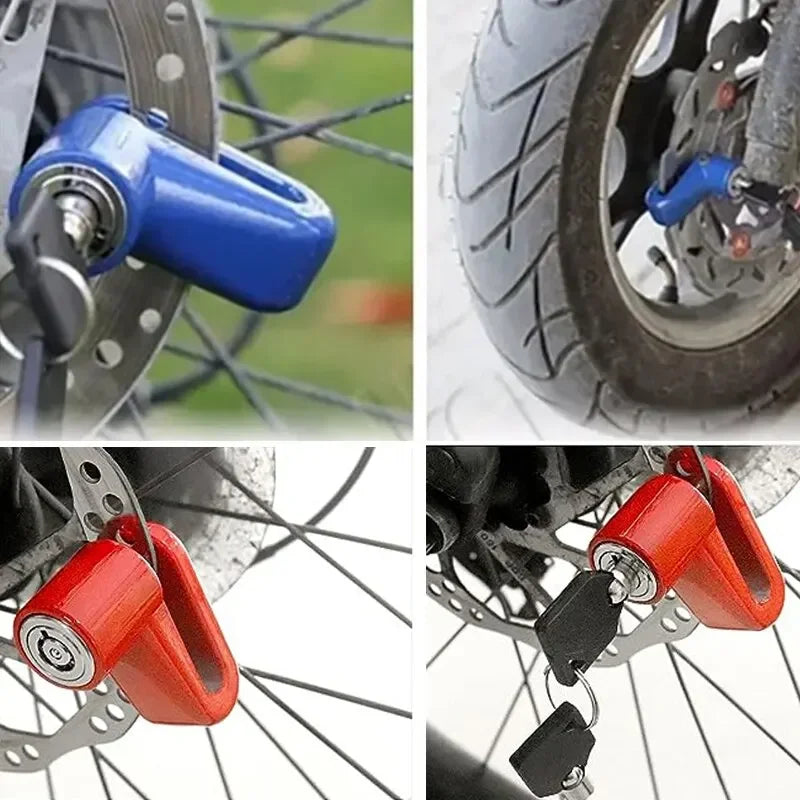 Close-up of a blue heavy duty motorcycle wheel disc brake lock mechanism and a red locking device on a bicycle wheel.