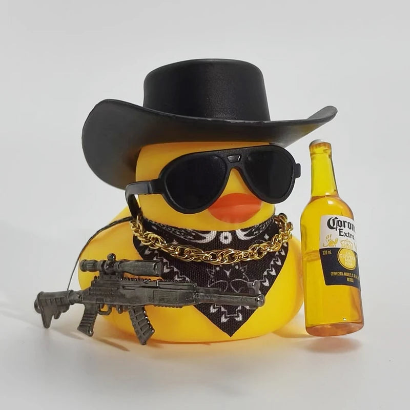 A yellow rubber duck wearing a black cowboy hat and sunglasses is next to a bottle of Corona Extra.