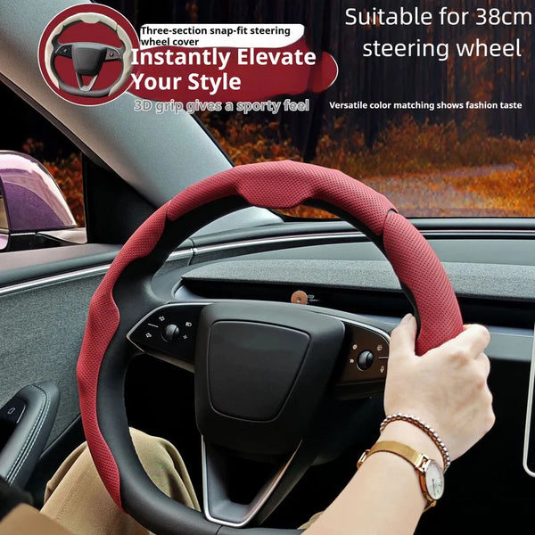 A person is holding a red steering wheel cover on a car steering wheel, demonstrating its fit and style.