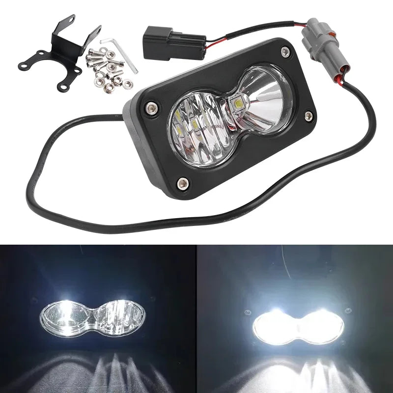 A black LED headlight switch kit with a light bulb and wiring harness for a Sur-Ron Segway Talaria.