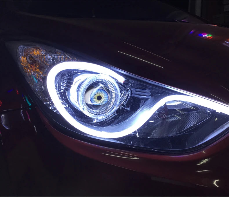 Close-up of a car headlight featuring an LED halo ring with dynamic lighting visible.