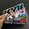 A set of iridescent and colored decals featuring the text Racing Suspensions for motorcycles.