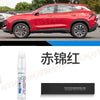 A bottle of red automotive touch-up paint pen kit for scratch repair