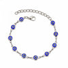 Gold plated evil eye charm bracelet featuring adjustable link chain and blue eye charms