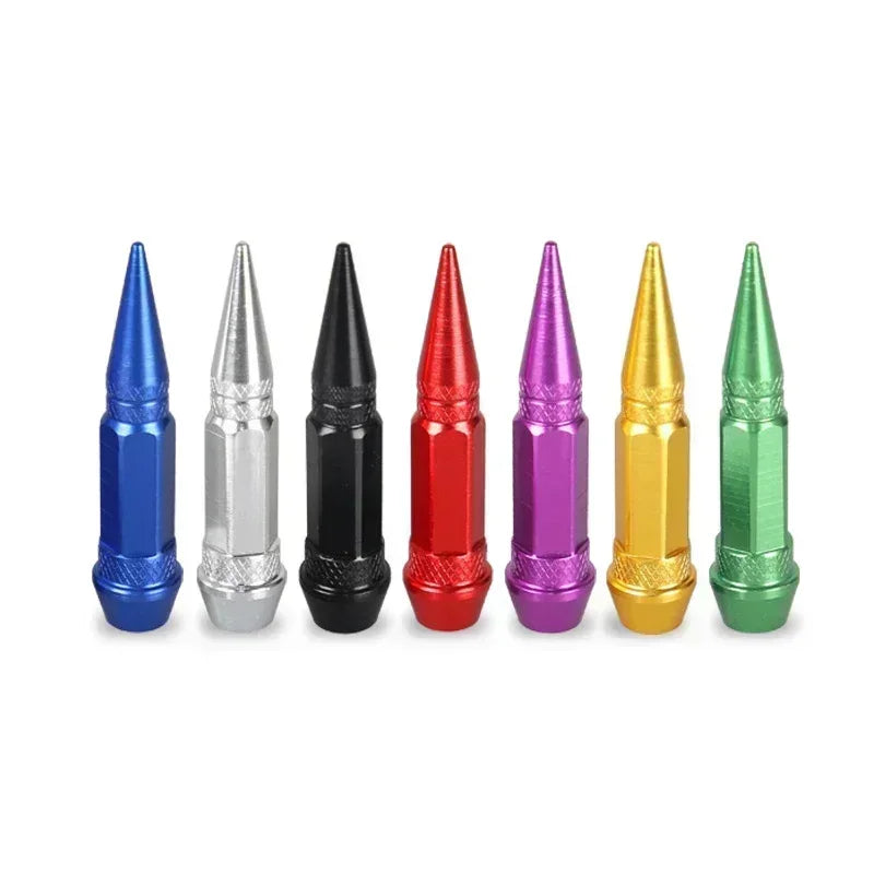 A set of four aluminum tire valve stem caps in various colors including blue, silver, black, and green.