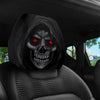 Protector para reposacabezas de coche con diseño de calavera negra y ojos rojos brillantes.