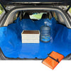 Blue waterproof car trunk liner mat with a storage box and a bottle inside the trunk.